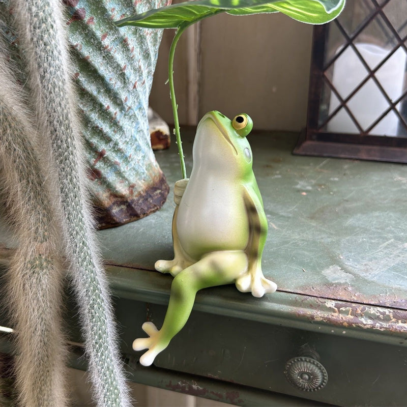 Little frog sheltering from the rain